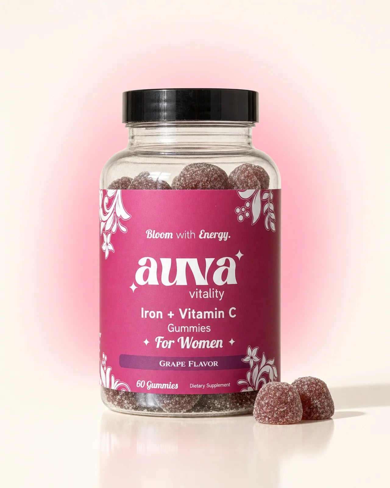Auva Vitality Iron + Vitamin C grape gummies jar with two gummies beside it