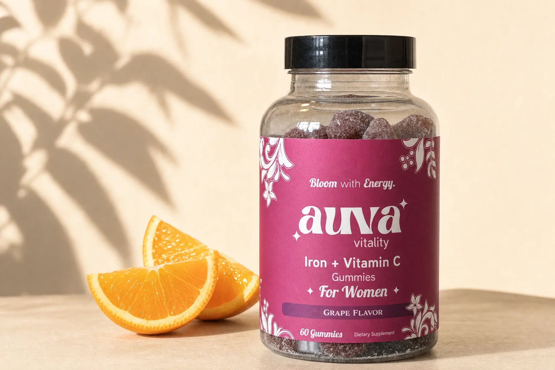 Auva jar beside orange slices on a cream backdrop